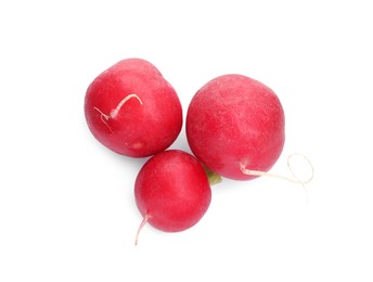 Photo of Three fresh ripe radishes isolated on white, top view