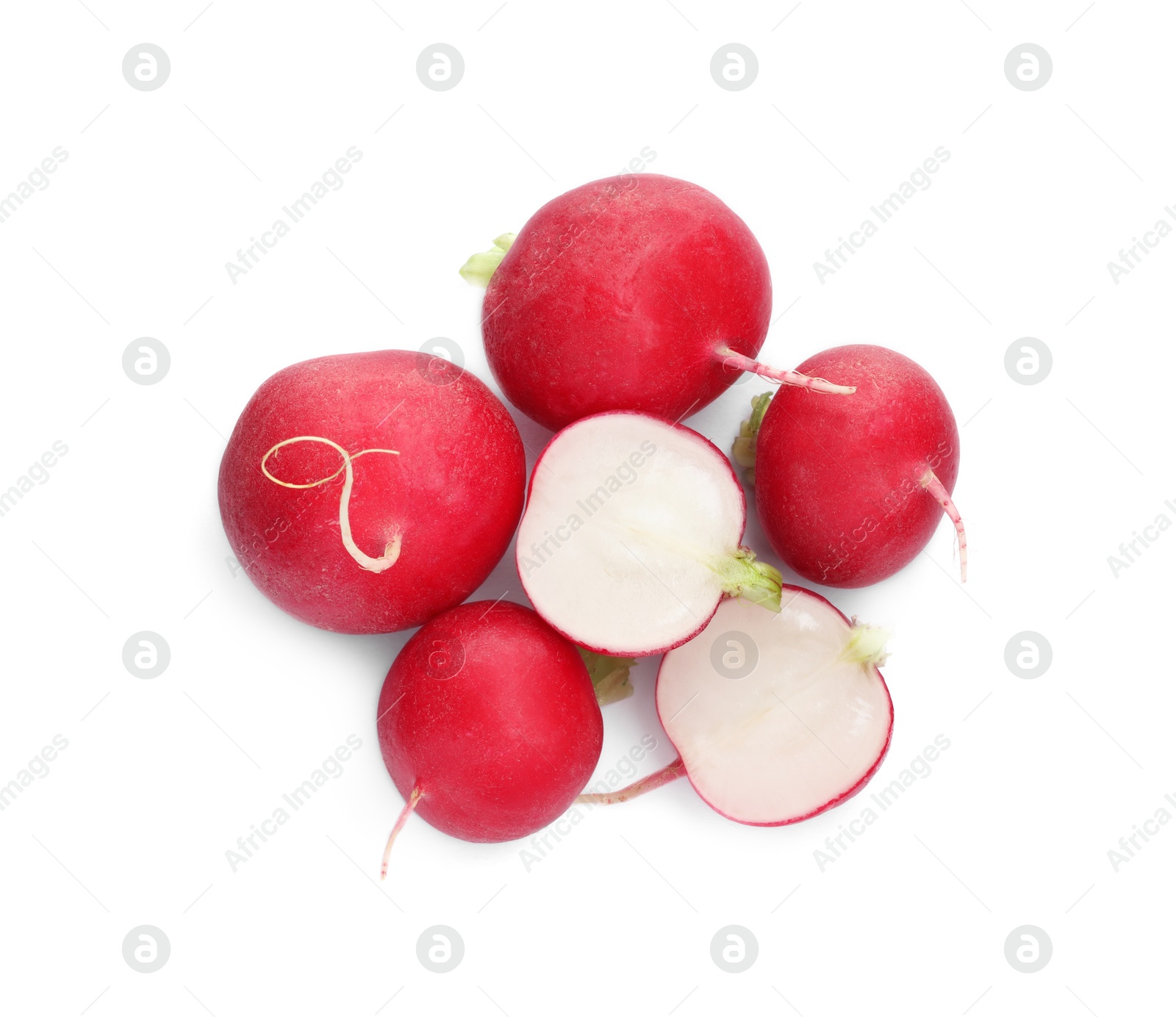 Photo of Whole and cut radishes isolated on white, top view