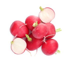 Photo of Whole and cut radishes isolated on white, top view