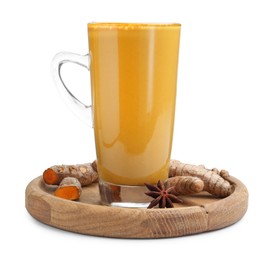 Photo of Delicious turmeric latte in glass cup, roots and anise star isolated on white