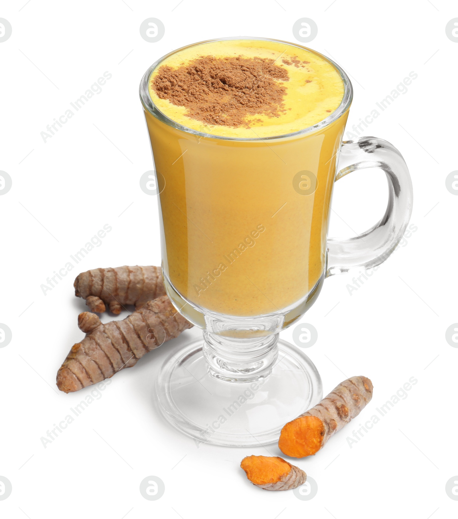 Photo of Delicious turmeric latte in glass cup and roots isolated on white