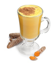 Photo of Delicious turmeric latte in glass cup and roots isolated on white