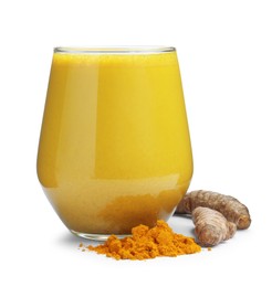 Photo of Delicious turmeric latte in glass, powder and roots isolated on white