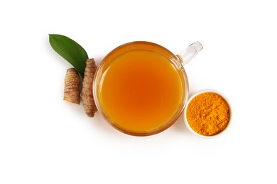 Photo of Aromatic turmeric tea in glass cup, roots, powder and green leaf isolated on white, top view