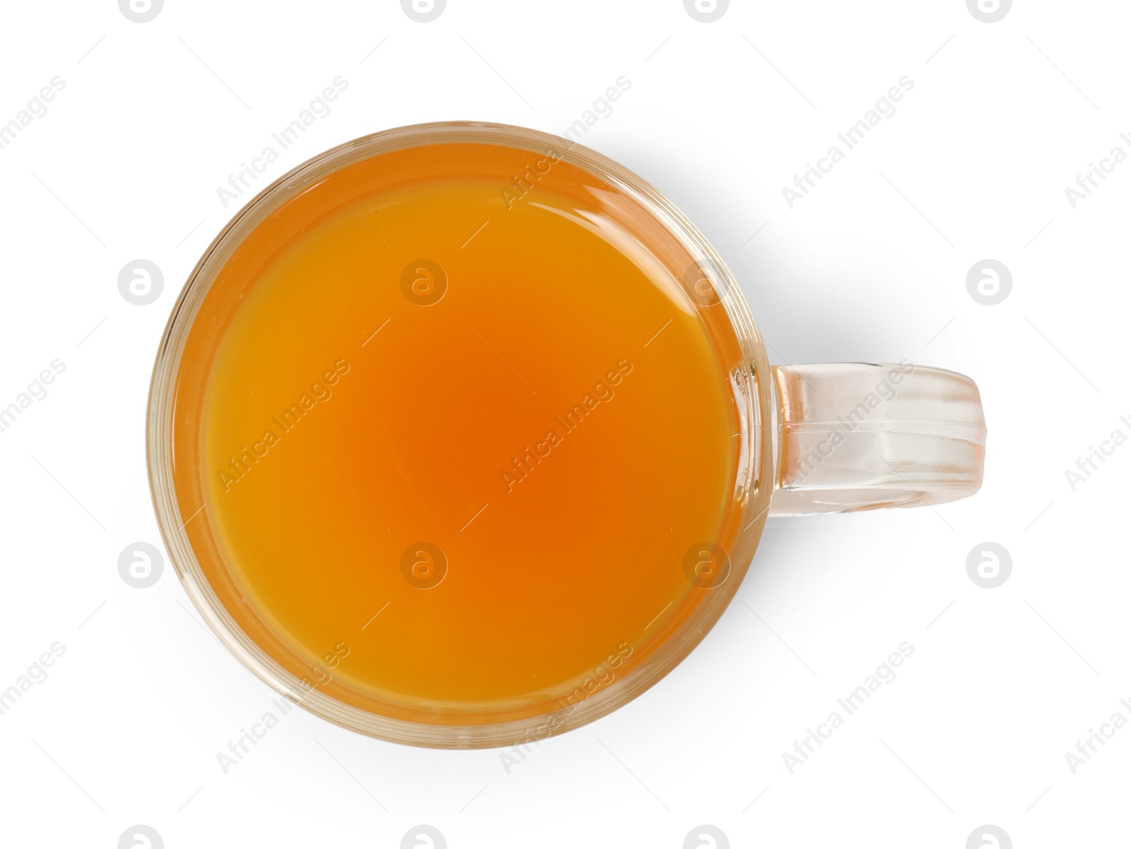 Photo of Aromatic turmeric tea in glass cup isolated on white, top view