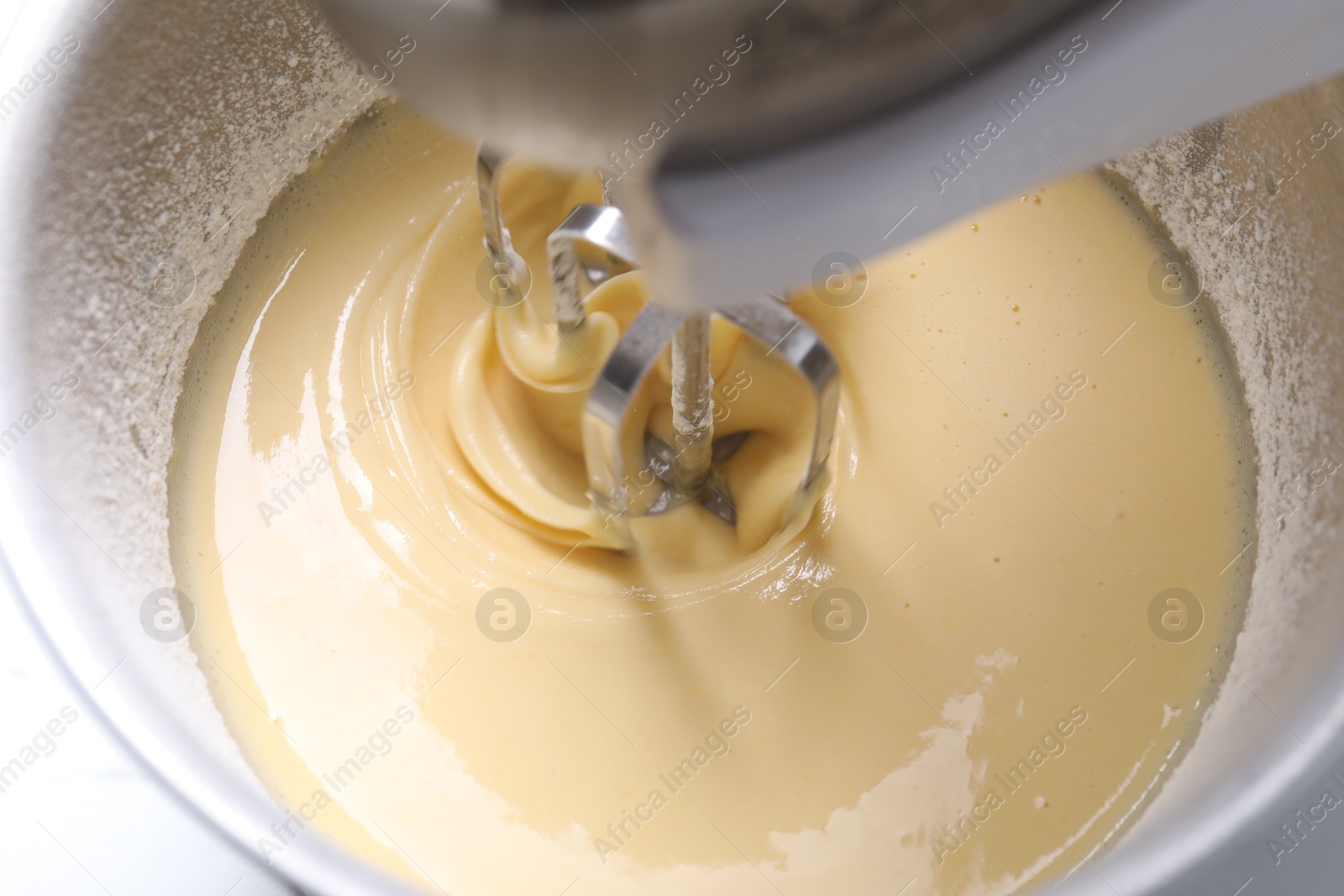 Photo of Making dough in bowl of stand mixer, above view