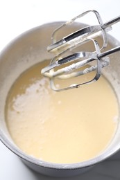 Photo of Hand mixer and bowl of dough, above view