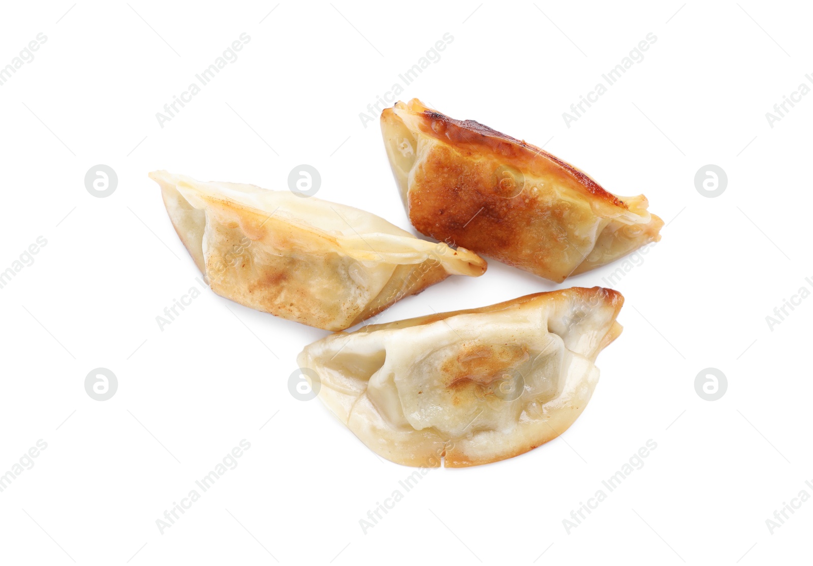 Photo of Delicious fried gyoza dumplings isolated on white, top view