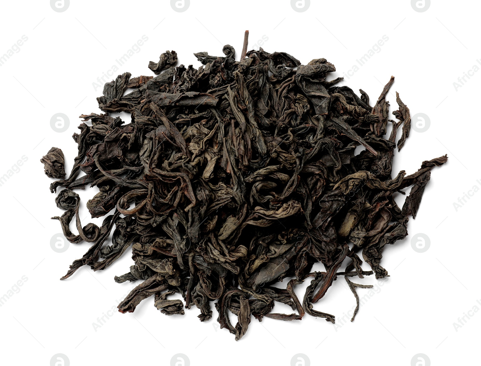 Photo of Pile of dry tea leaves isolated on white, top view