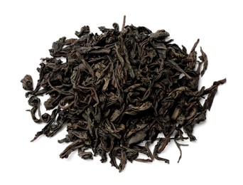 Photo of Pile of dry tea leaves isolated on white, top view