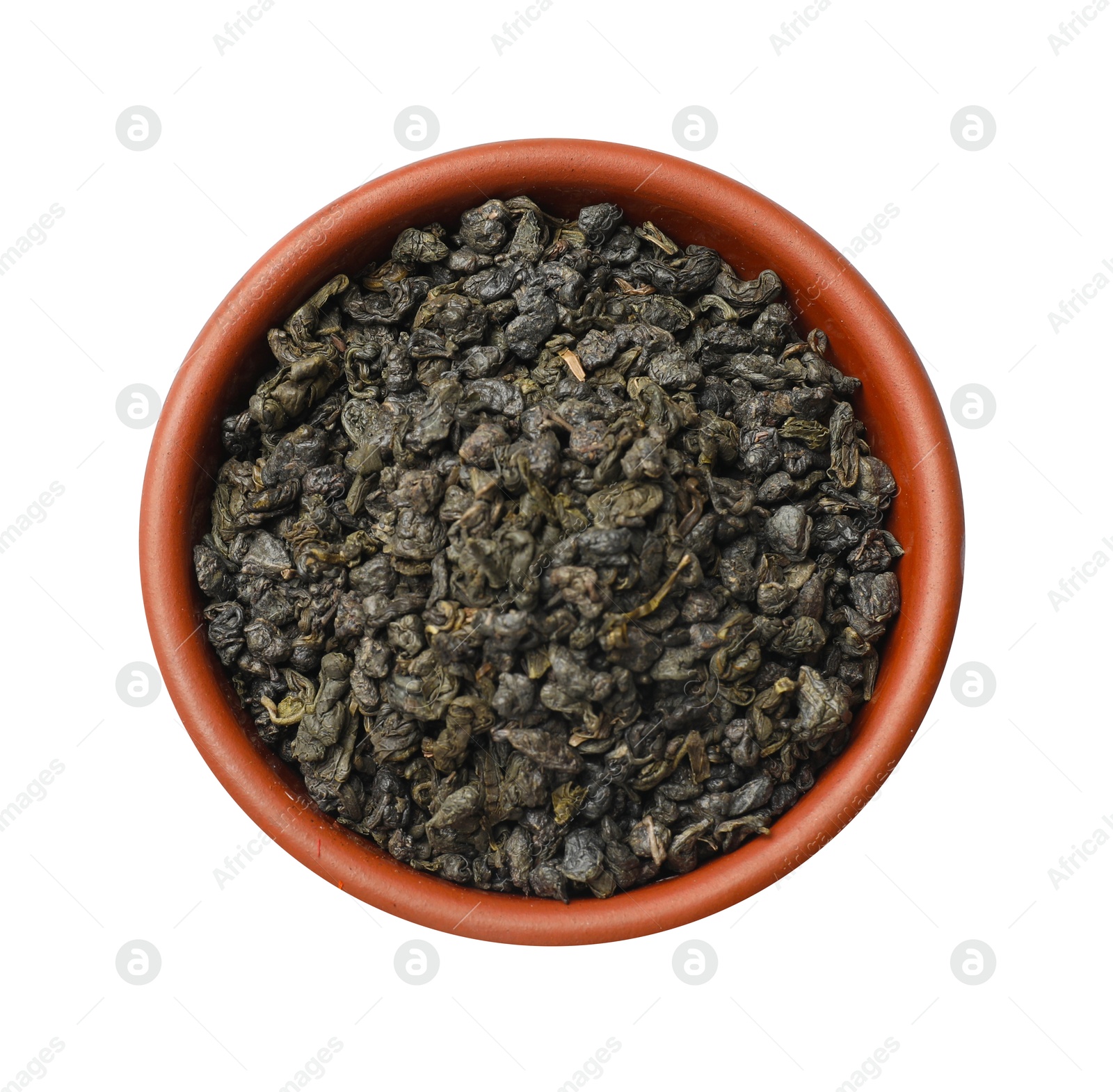 Photo of Dry tea leaves in bowl isolated on white, top view