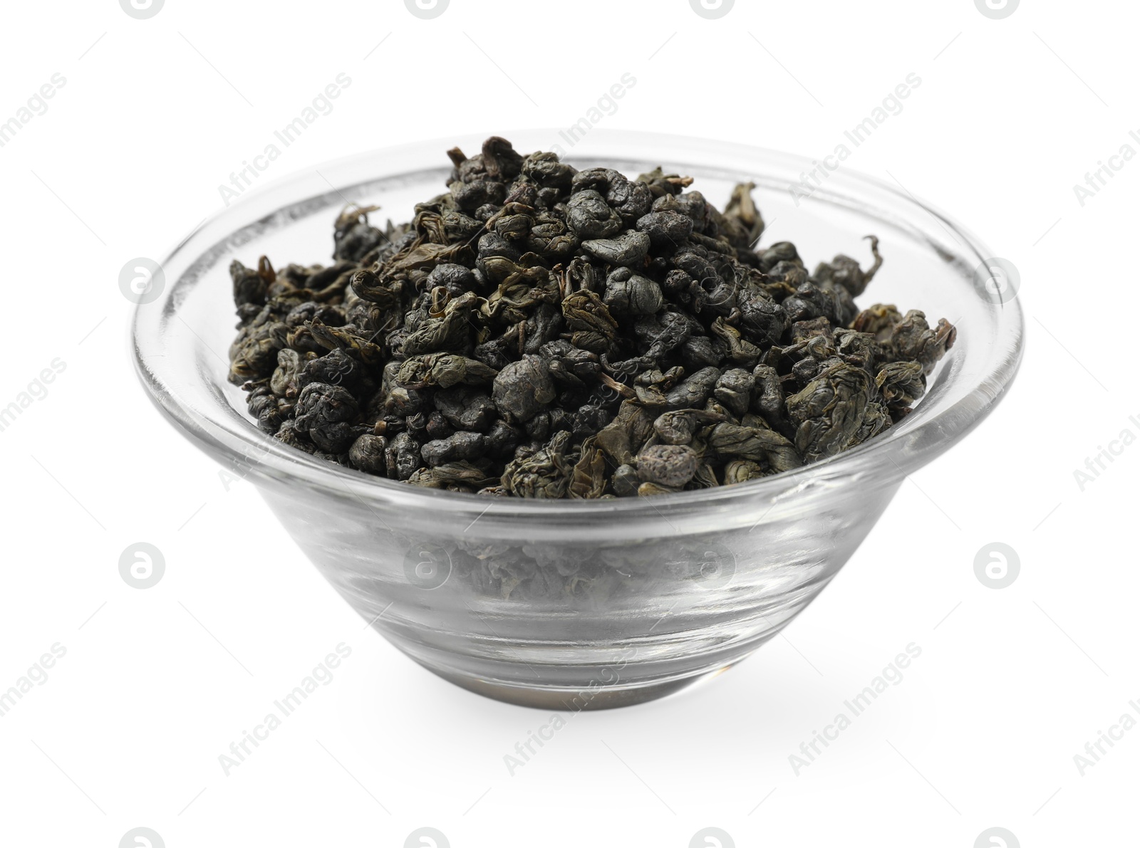 Photo of Dry tea leaves in bowl isolated on white