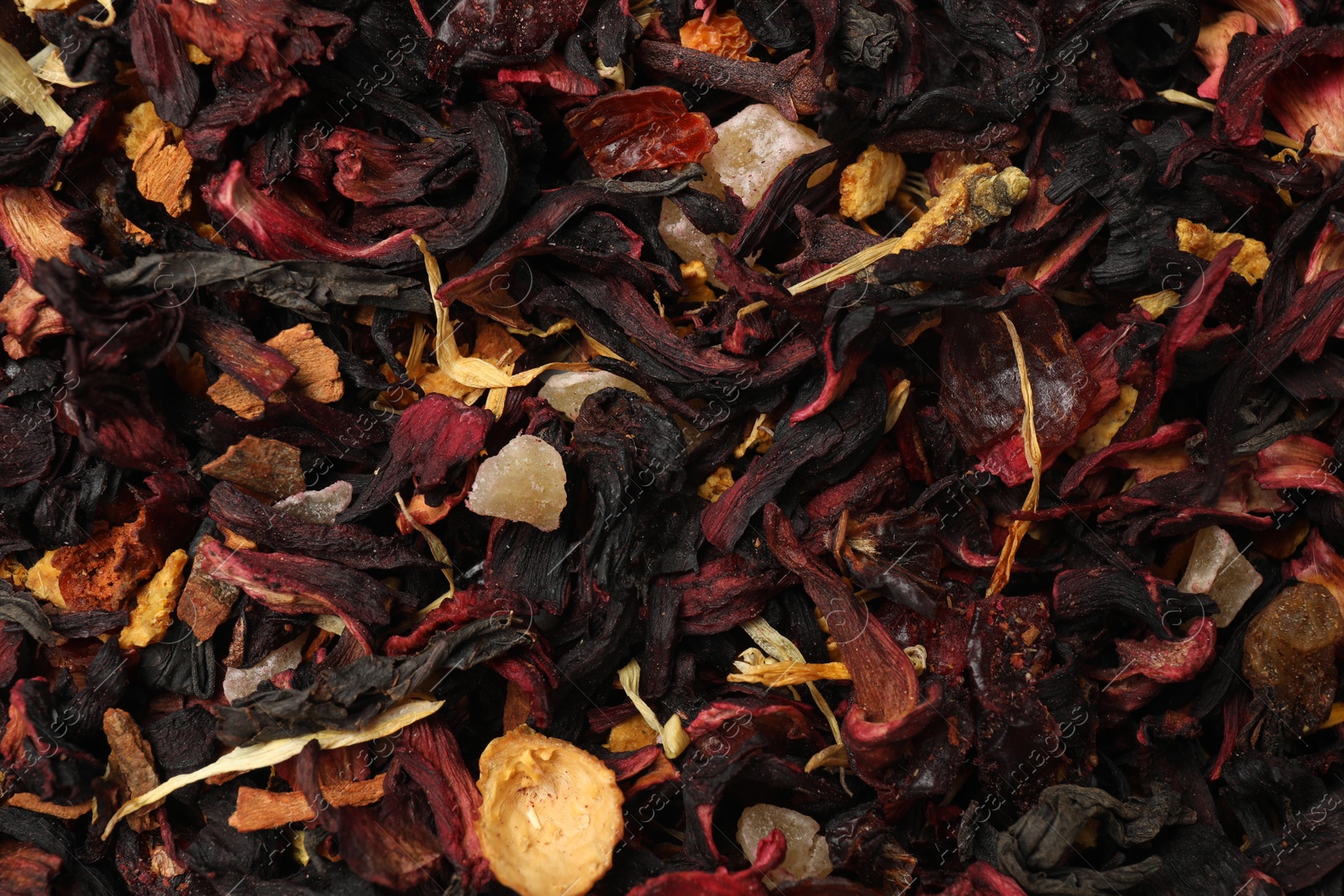 Photo of Aromatic dried tea leaves as background, closeup