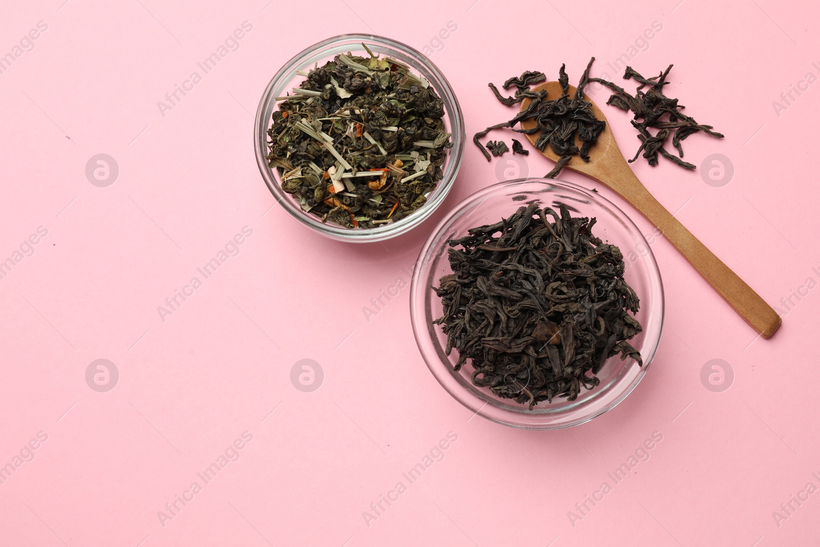 Photo of Different types of tea brew on light pink background, flat lay. Space for text