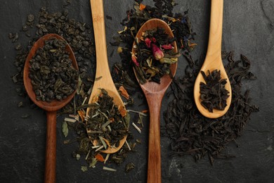 Photo of Different types of tea brew on black table, flat lay