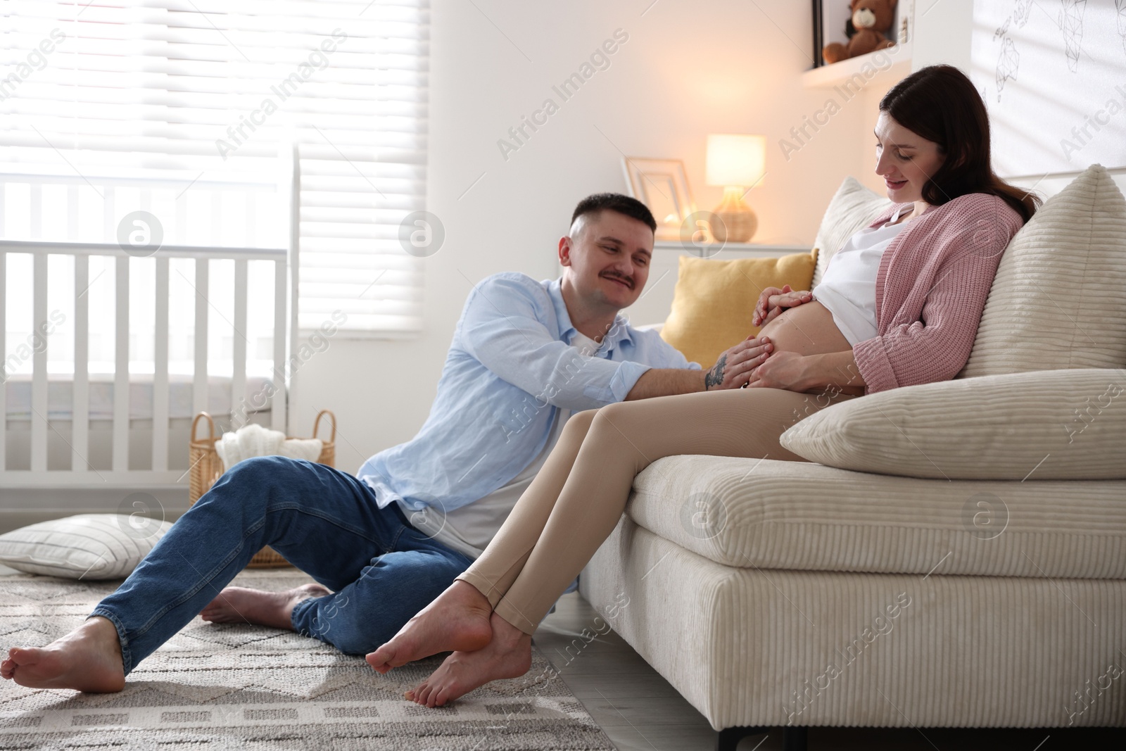 Photo of Pregnant woman and her husband at home