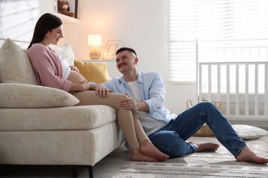 Photo of Pregnant woman and her husband at home