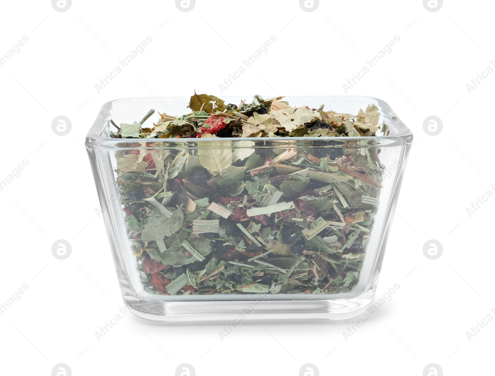 Photo of Dry herbal tea brew in bowl isolated on white