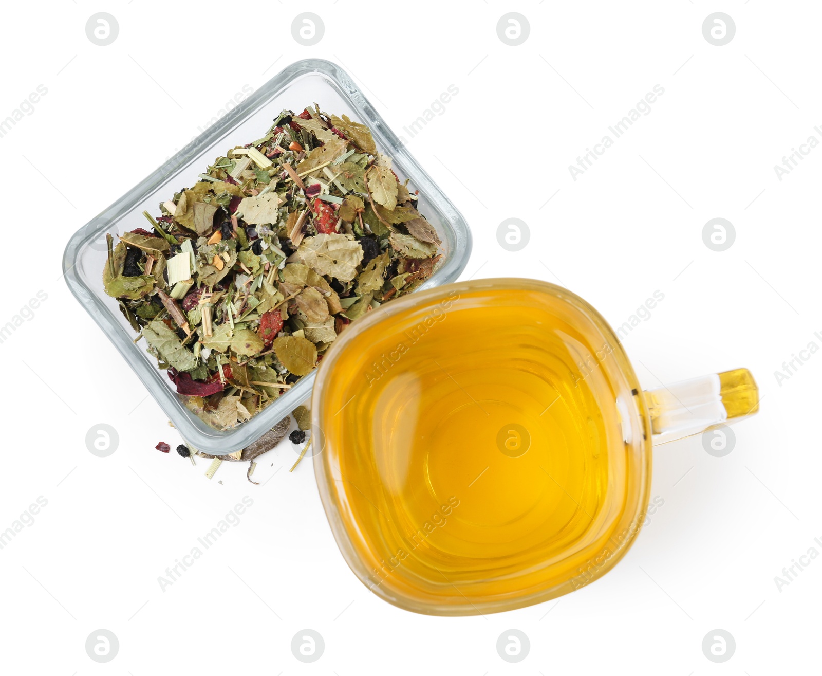 Photo of Delicious herbal tea and dry leaves isolated on white, top view