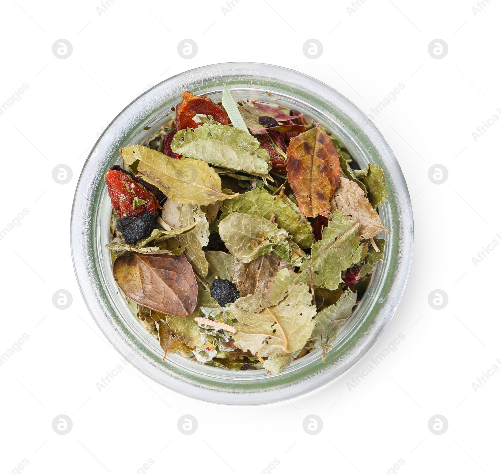 Photo of Dry herbal tea brew in jar isolated on white, top view