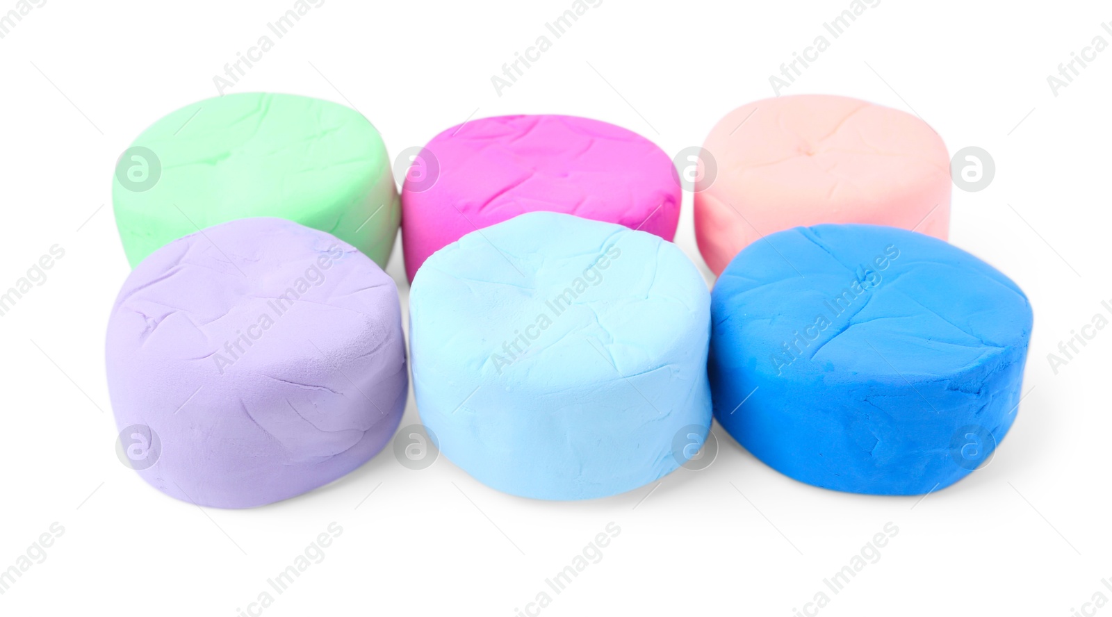 Photo of Different colorful play dough isolated on white