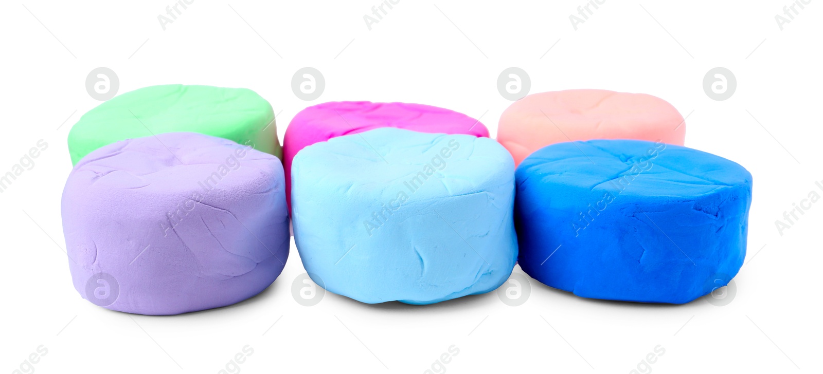 Photo of Different colorful play dough isolated on white