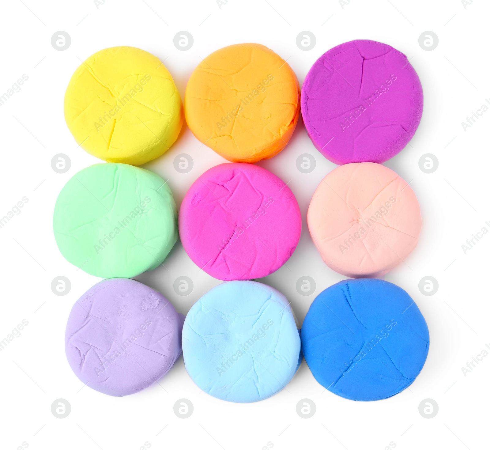 Photo of Different colorful play dough isolated on white, top view