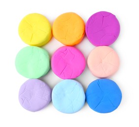 Photo of Different colorful play dough isolated on white, top view