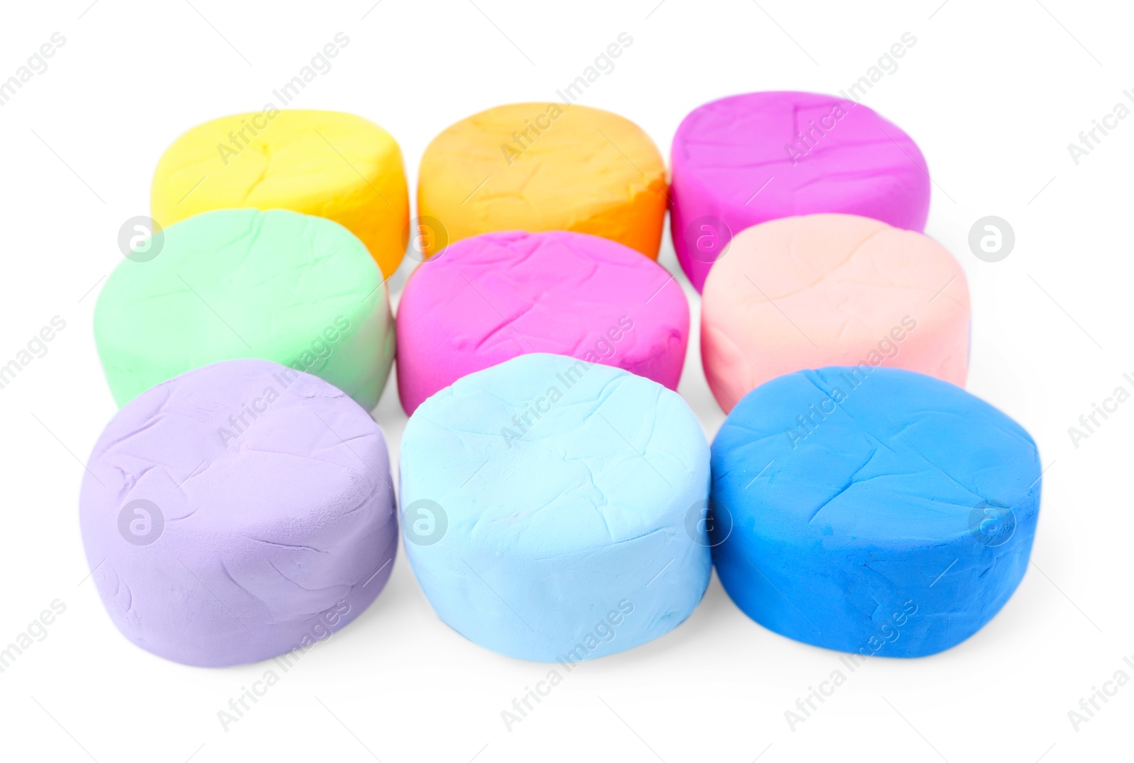 Photo of Different colorful play dough isolated on white