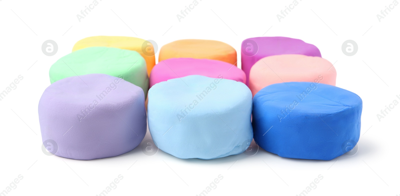 Photo of Different colorful play dough isolated on white