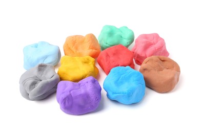 Photo of Different colorful play dough isolated on white