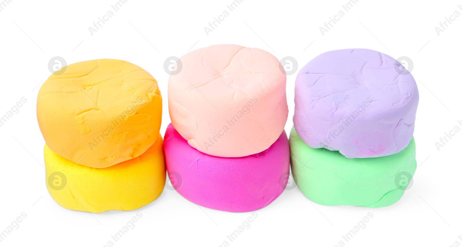 Photo of Different colorful play dough isolated on white