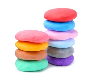 Photo of Different colorful play dough isolated on white