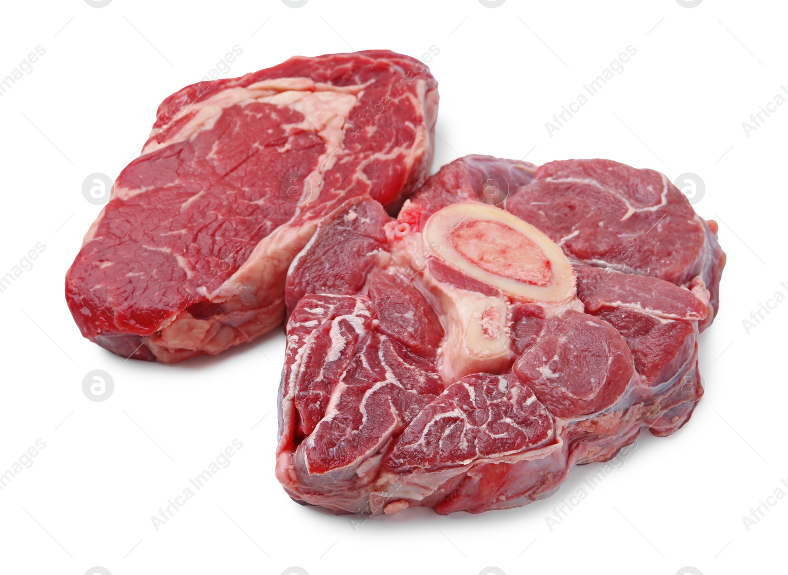 Photo of Pieces of raw beef meat isolated on white