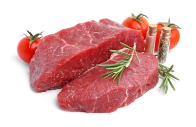 Photo of Pieces of raw beef meat, spices and tomatoes isolated on white