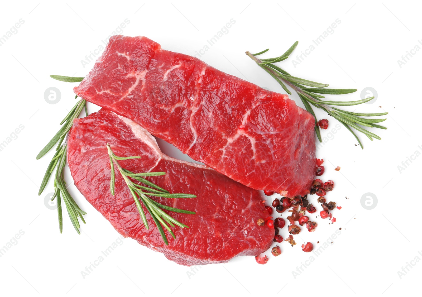 Photo of Pieces of raw beef meat and spices isolated on white, top view