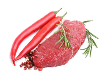 Photo of Piece of raw beef meat and spices isolated on white, above view