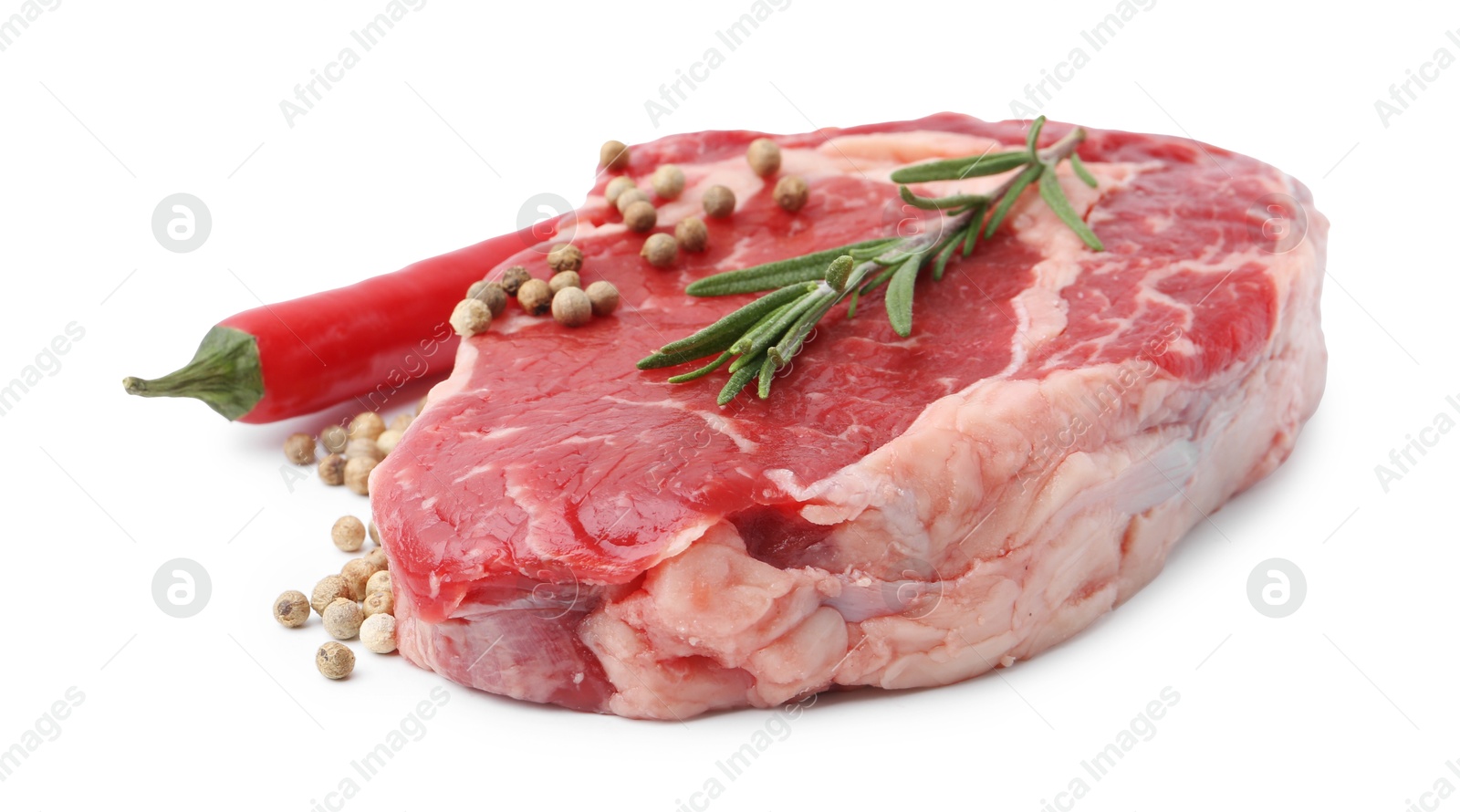 Photo of Piece of raw beef meat and spices isolated on white