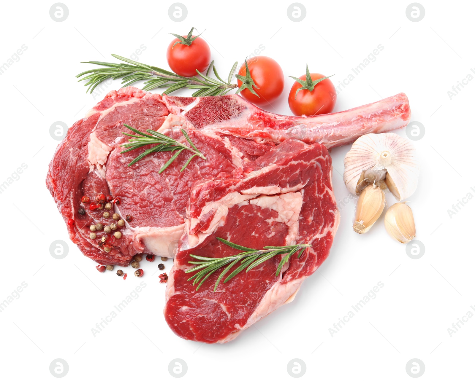 Photo of Pieces of raw beef meat, spices and tomatoes isolated on white, top view