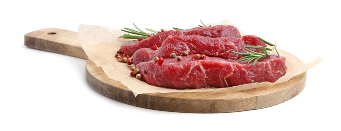 Photo of Pieces of raw beef meat, rosemary and peppercorns isolated on white