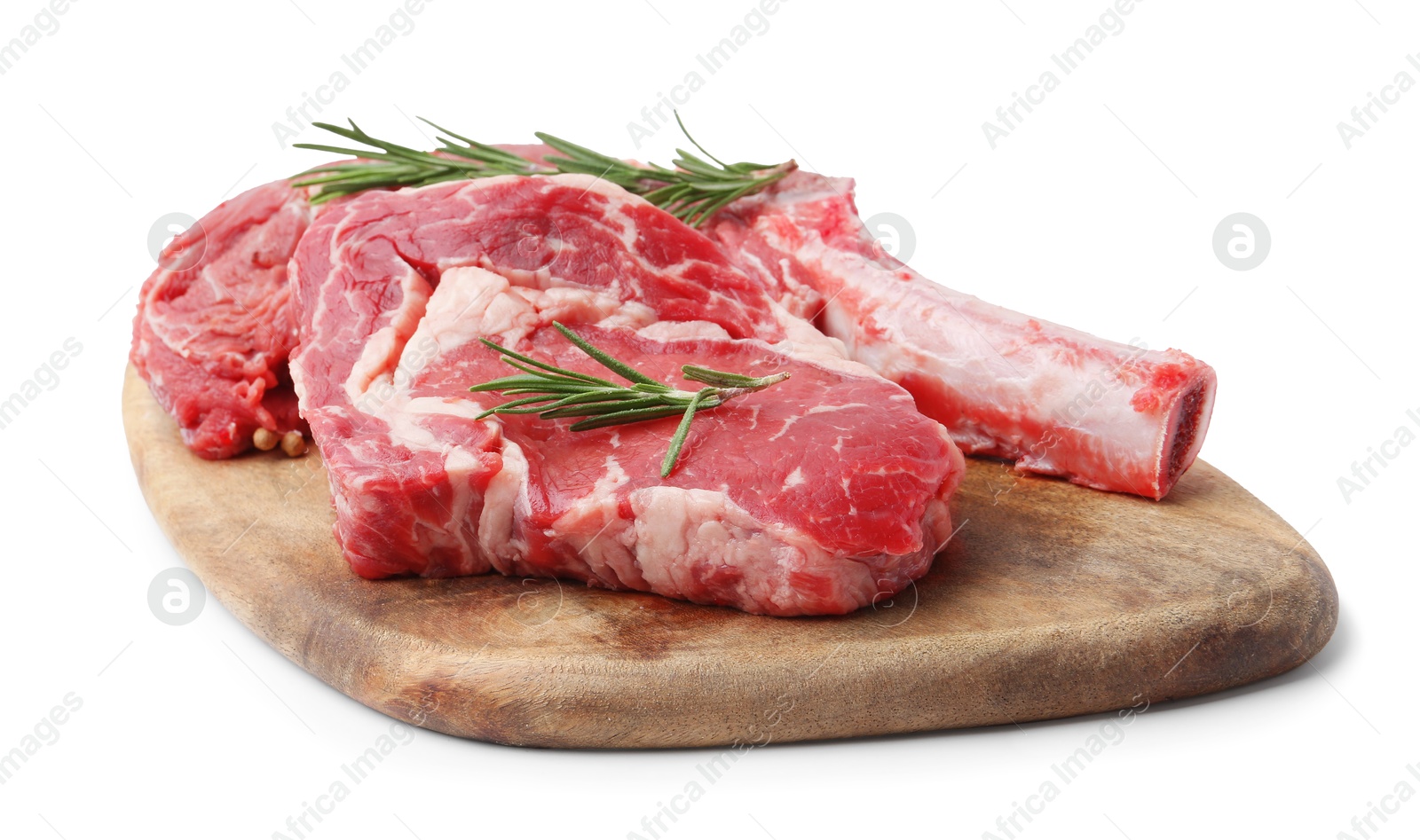 Photo of Pieces of raw beef meat and rosemary isolated on white