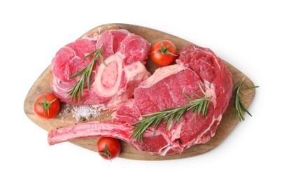 Photo of Pieces of raw beef meat, spices and tomatoes isolated on white, top view