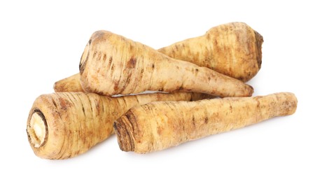 Photo of Many fresh parsnips isolated on white. Root vegetable