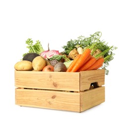 Different root vegetables in wooden crate isolated on white