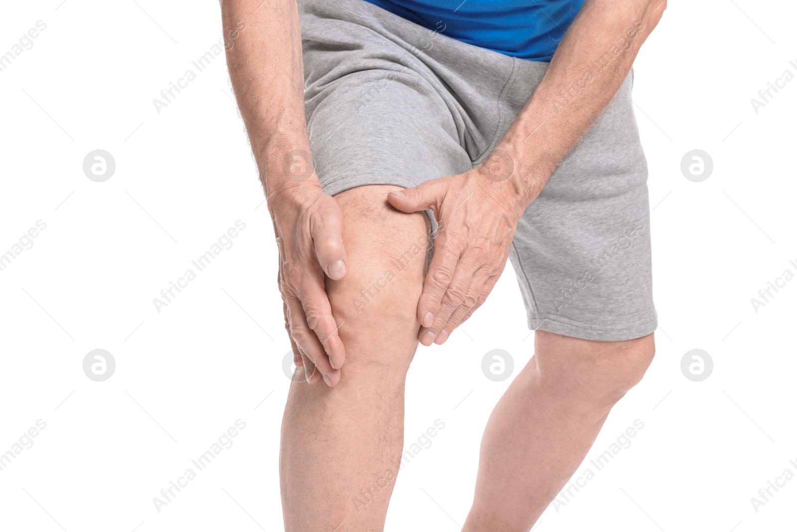 Photo of Senior man suffering from knee pain on white background, closeup