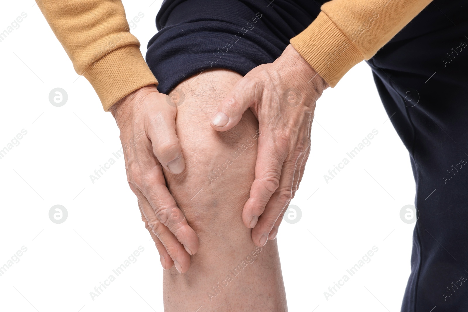 Photo of Senior man suffering from knee pain on white background, closeup