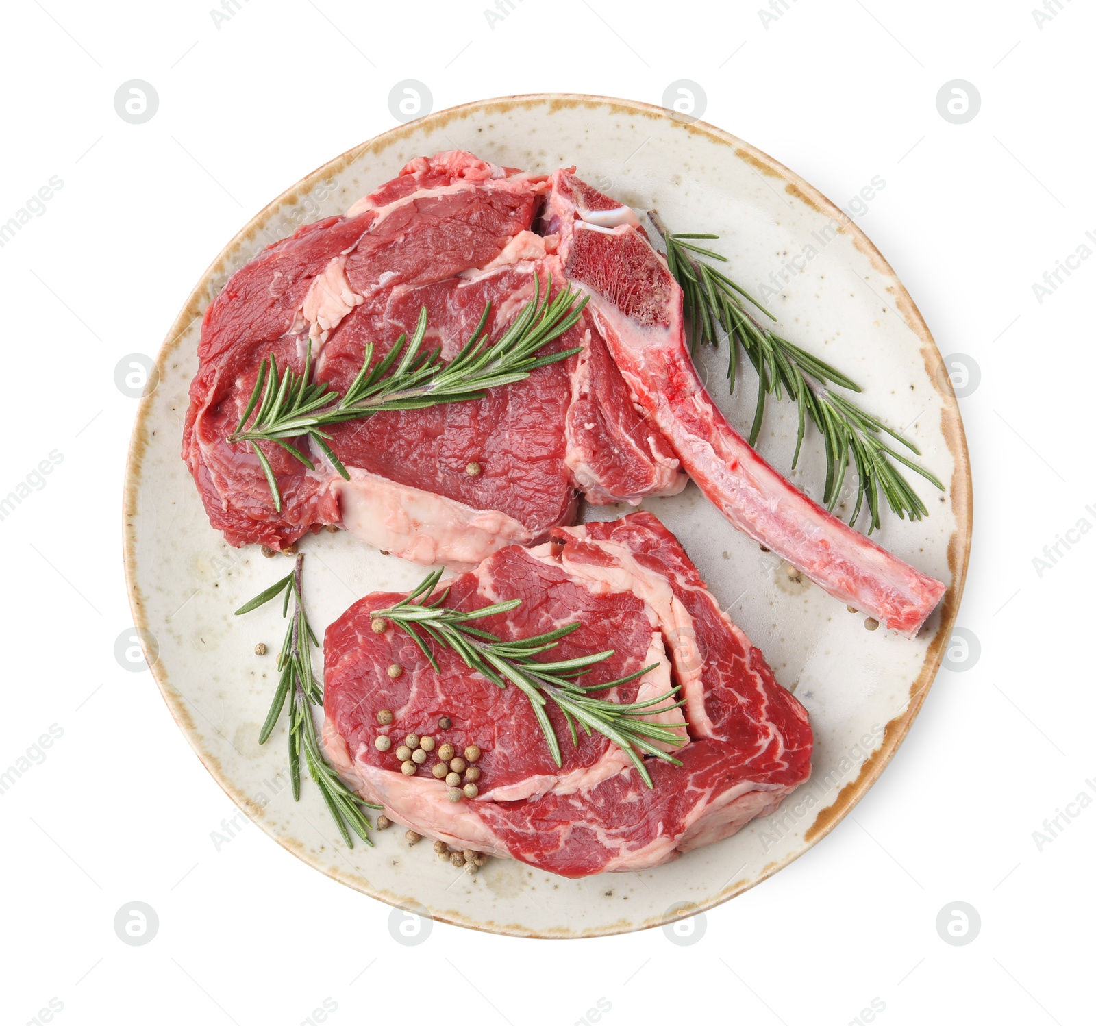 Photo of Pieces of raw beef meat and spices isolated on white, top view