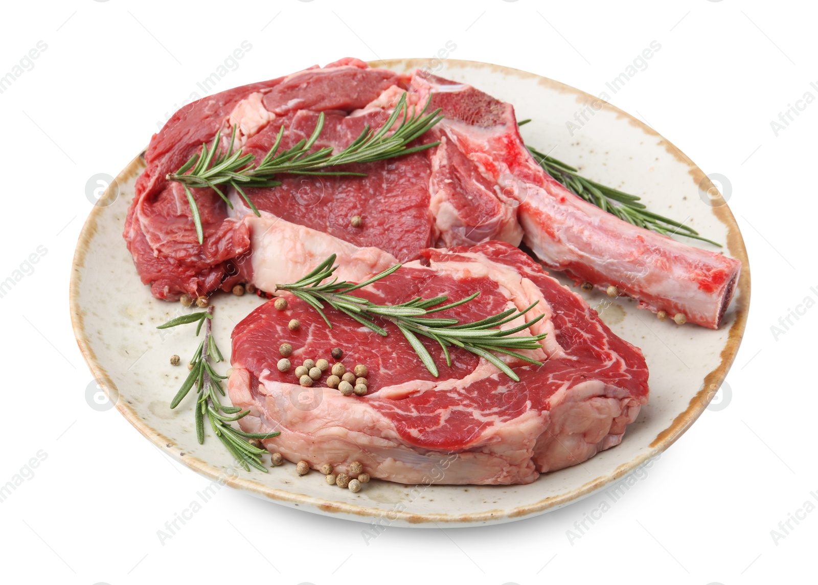 Photo of Pieces of raw beef meat and spices isolated on white