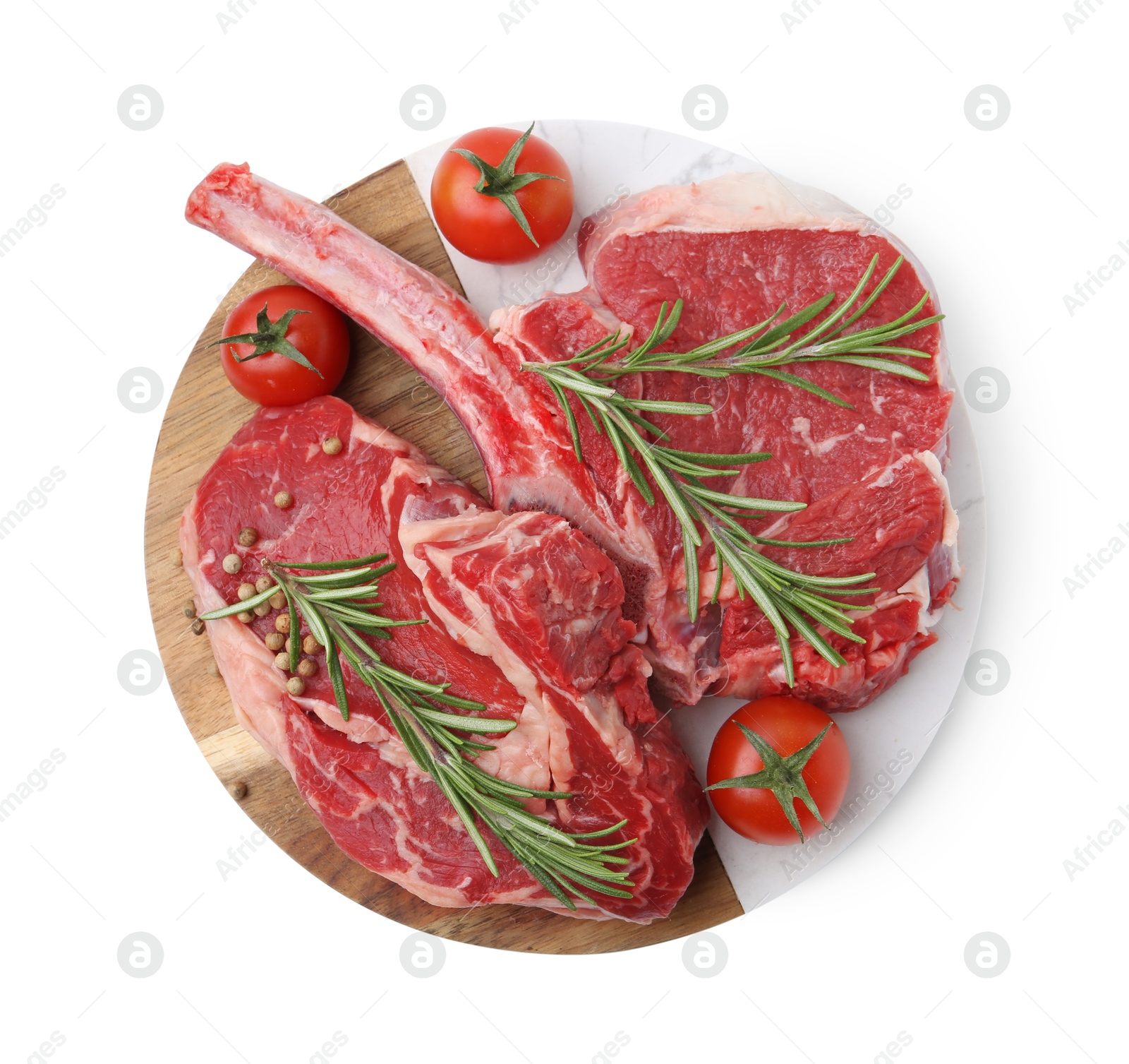 Photo of Pieces of raw beef meat, spices and tomatoes isolated on white, top view