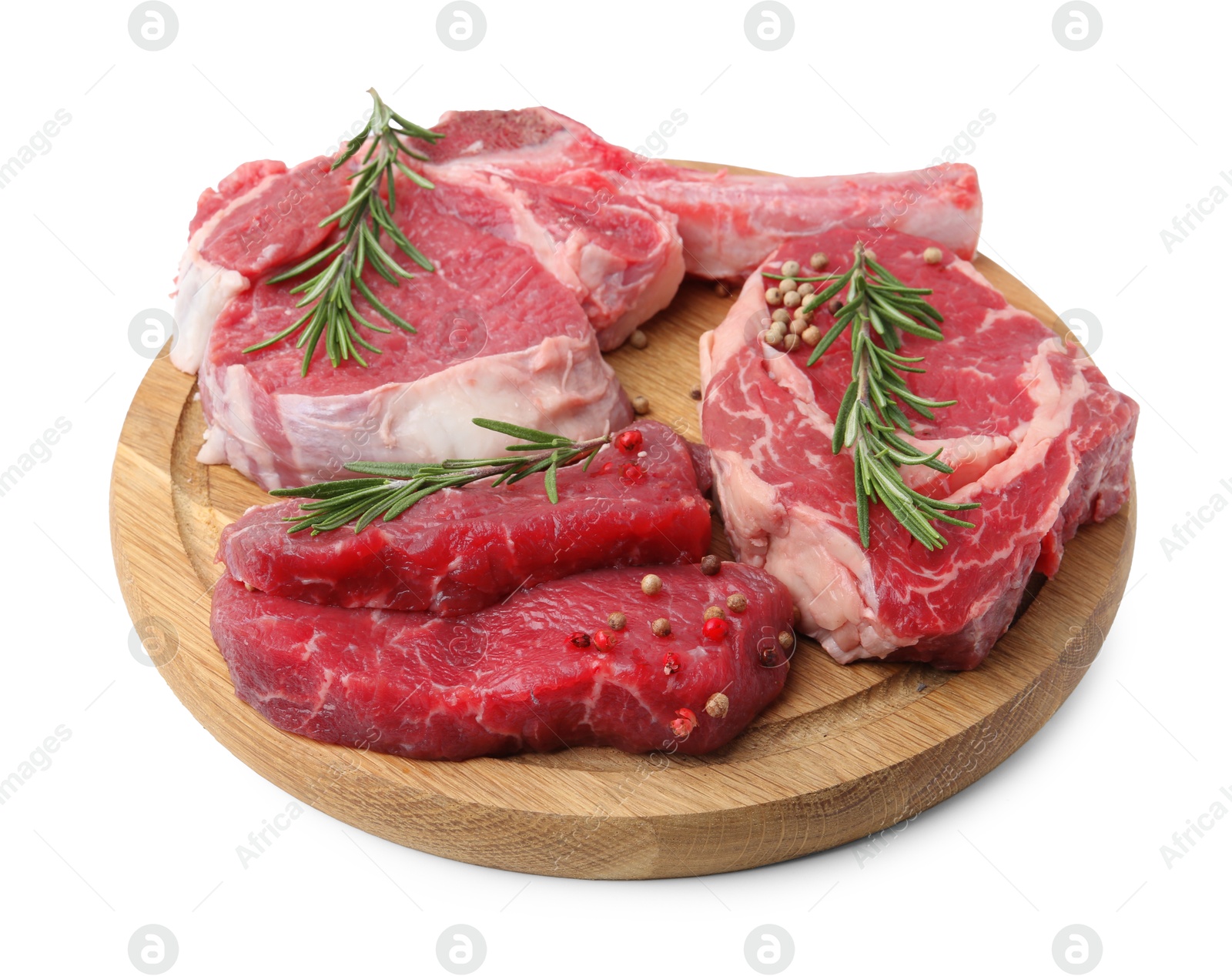 Photo of Pieces of raw beef meat and spices isolated on white